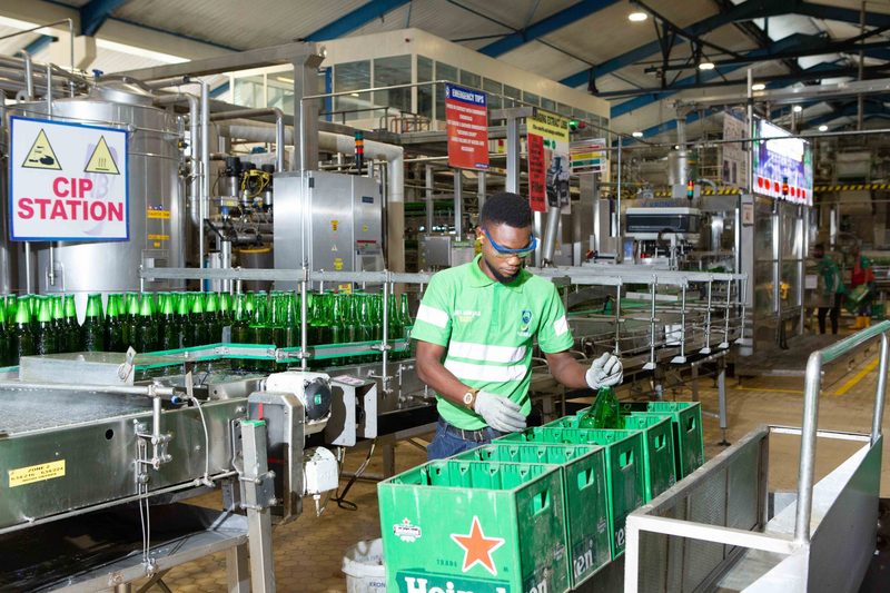 Worker on the bottling line at the Nigerian Breweries plant